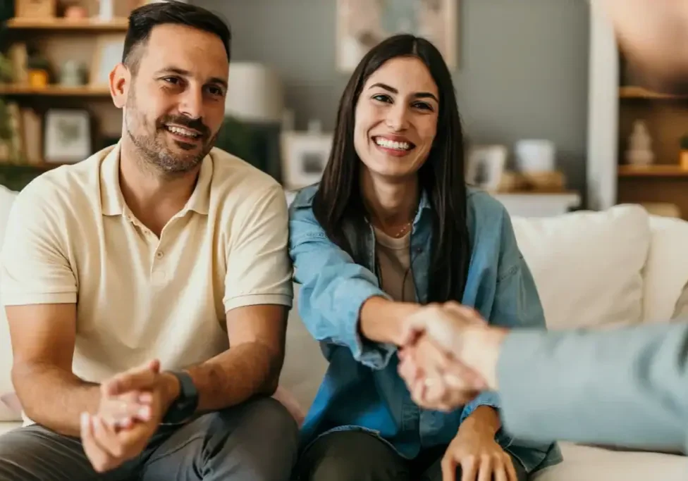 happy-couple-shaking-hands-in-a-relaxed-setting-2026-03-08-22-56-01-utc
