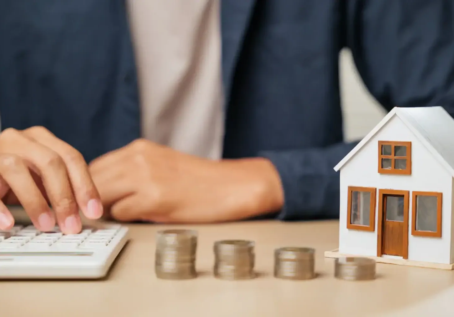 home-investment-with-stacked-coins-and-house-model-2026-01-09-11-38-45-utc