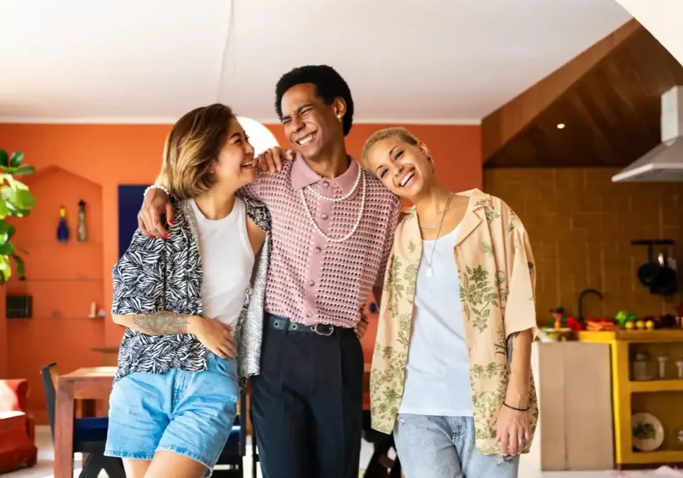 three-smiling-people-in-a-home-setting-2026-01-08-23-53-07-utc
